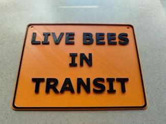 Live bees in transit sign.