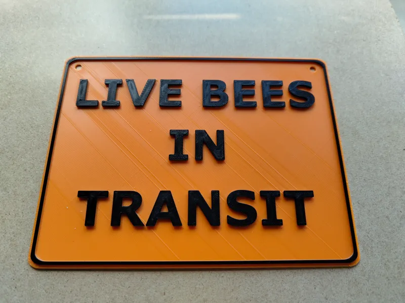 Live bees in transit sign.