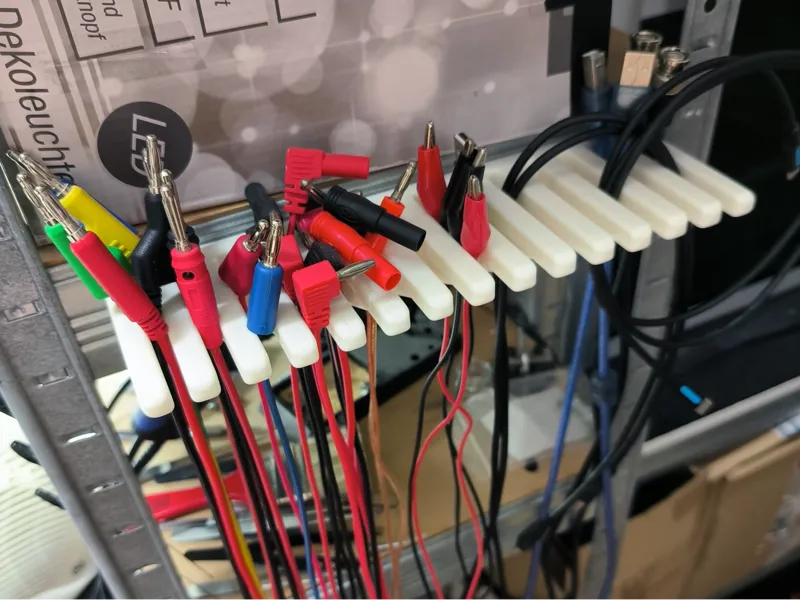 Cable holder - rake
