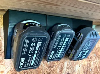 Ryobi Battery holder for wall, table or ceiling.
