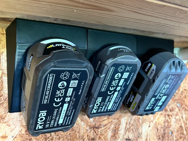 Ryobi Battery holder for wall, table or ceiling.