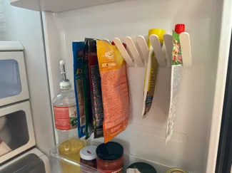 Refrigerator pouch holder