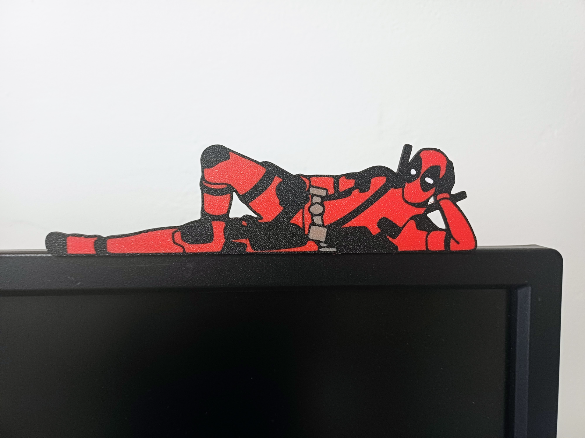 Deadpool on monitor with stand