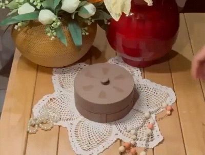 Rotating Jewelry Box with Automatic Drawer Opening