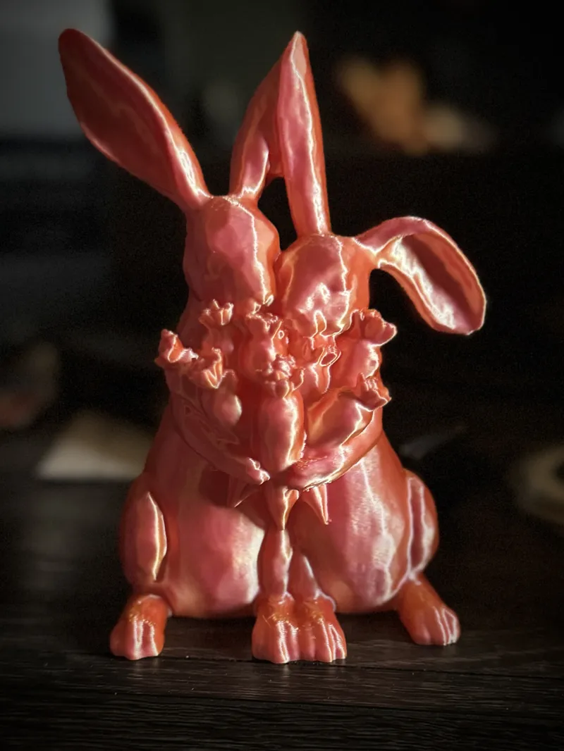 Two Rabbits Holding Carrots