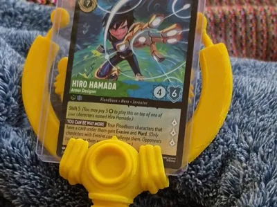 Lorcana Daisy's Septar and TCG toploader holder
