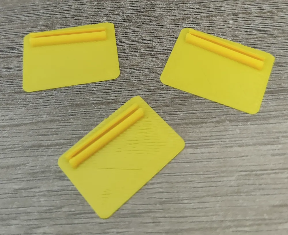 Adhesive angled filament clip with doublesided tape cutting jig by