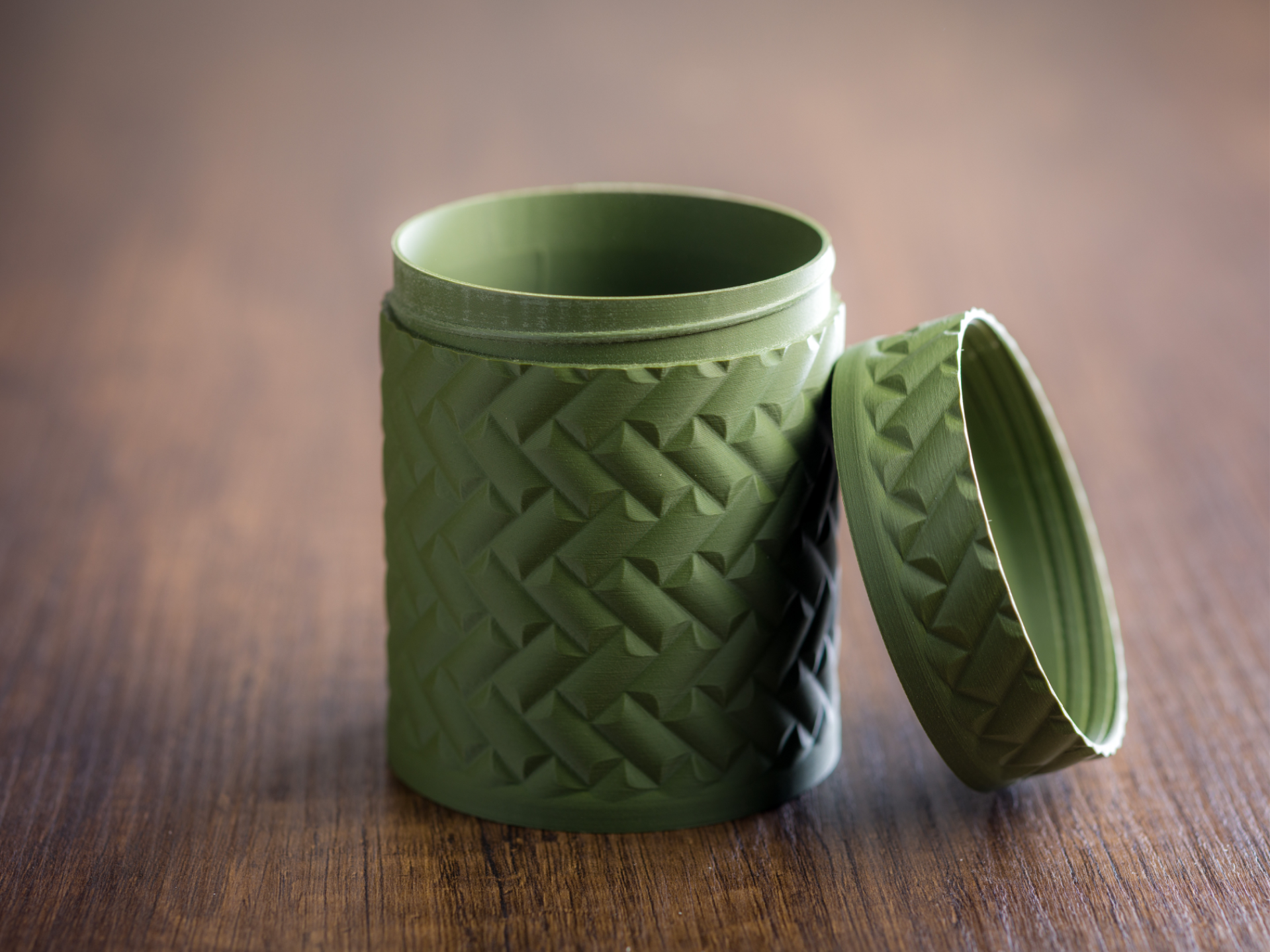 Round container with screw cap.