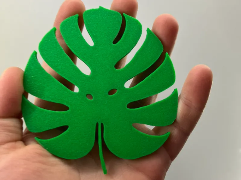 cup stand in the shape of a monstera leaf