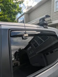 Extended SMA antenna mount window with wind visor