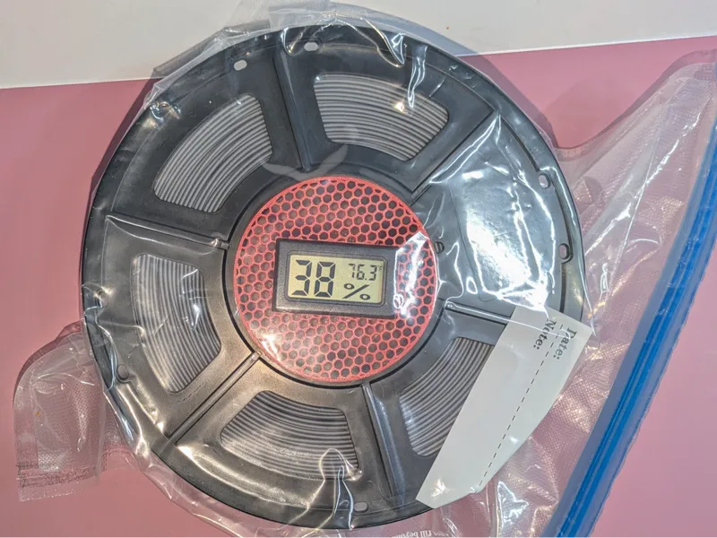 Vacuum bag hygrometer holder