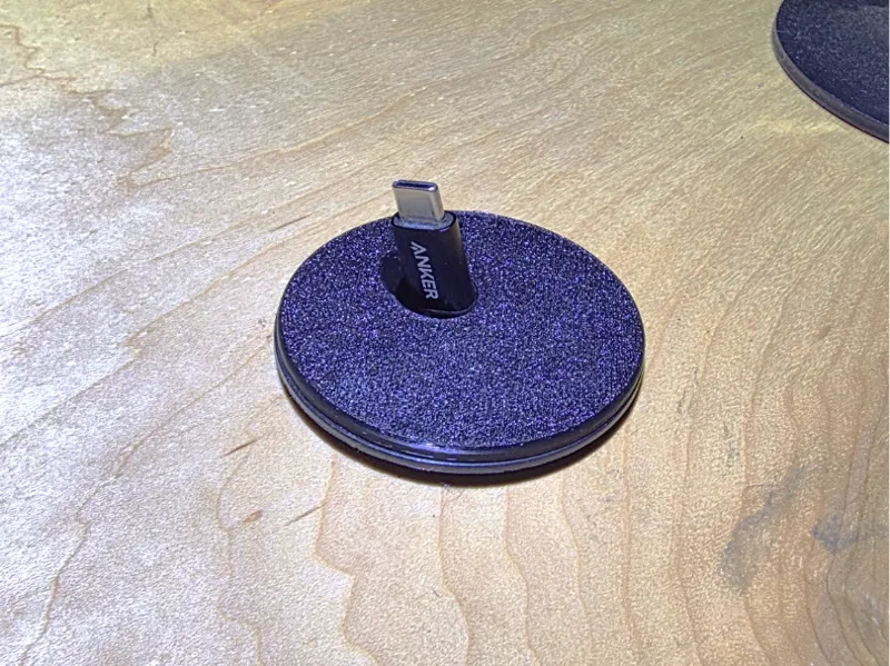 Minimalistic cord keeper for 2 inch desk hole