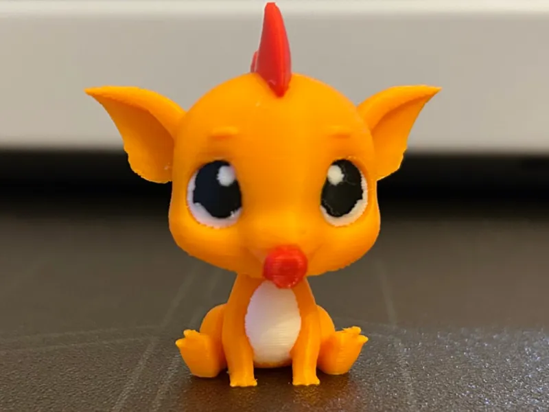 cute fire dragon with pacifier