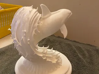 orca whale catching a wave