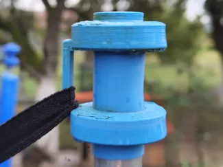 Trampoline net holder