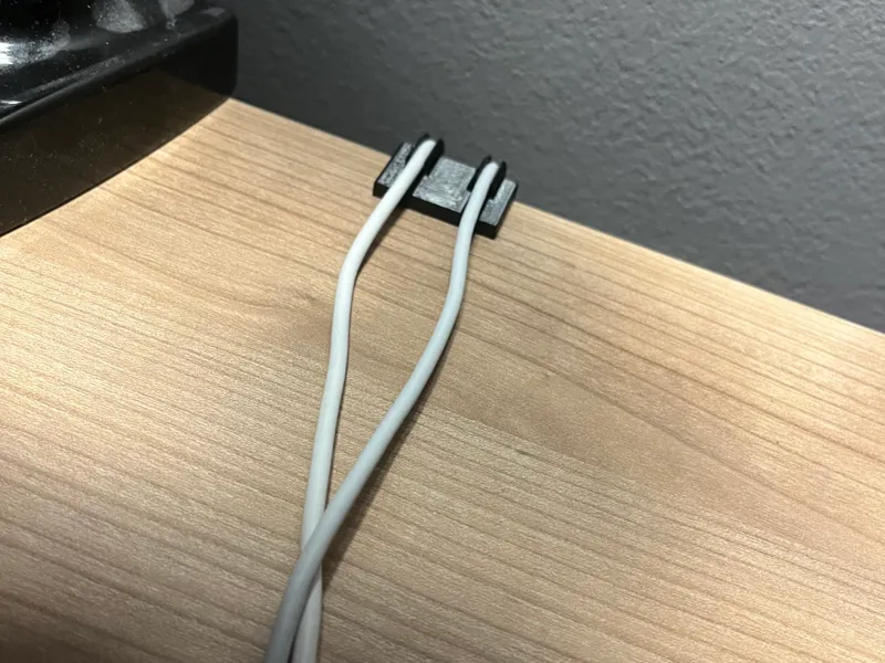 Cable organizer for 25mm desk