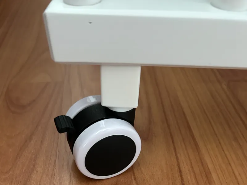 Radbefestigungsadapter für Babybett