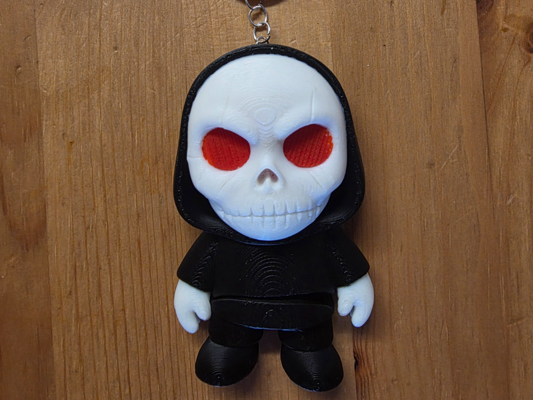 Flexi Skull Keyring