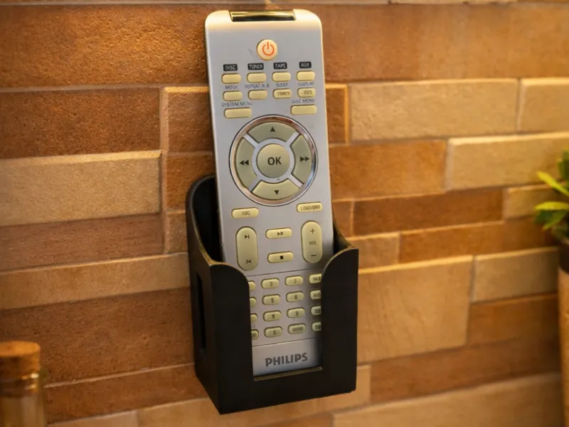 Universal wall-mounted holder for remote