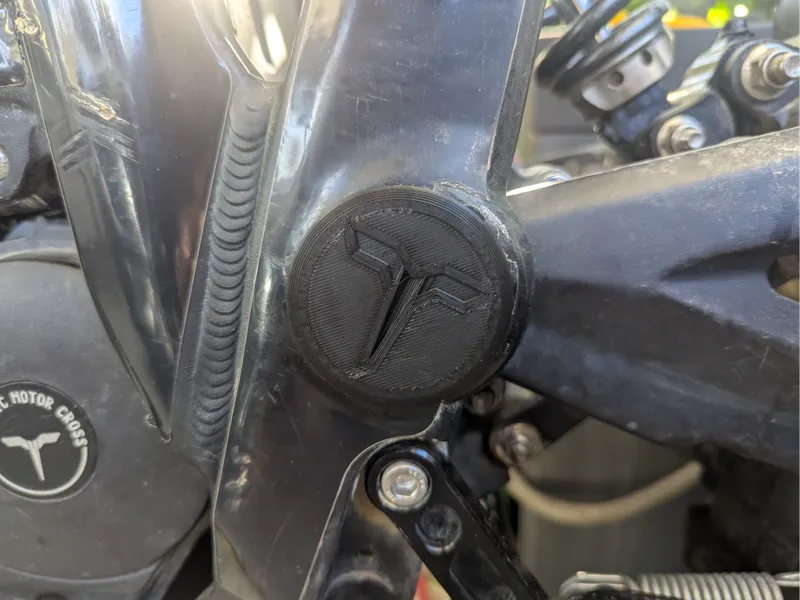 Cover for swingarm bolt Talaria Sting with logo