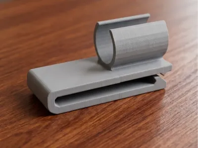 Belt clip for attaching a cane