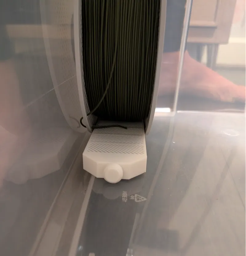 Under spool desiccant box