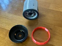 67 - 65mm filter socket adapter.