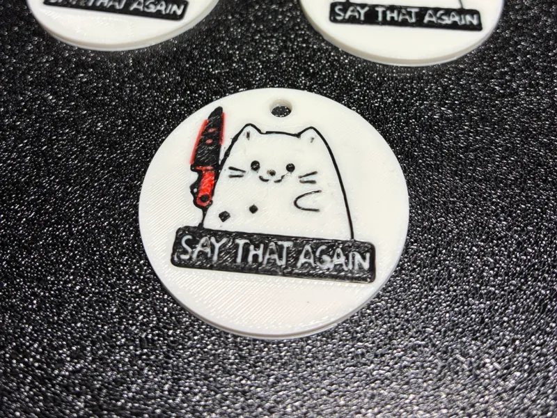 Keychain Cat with a Knife – "Say That Again" - AMS