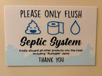 Septic toilet flush sign