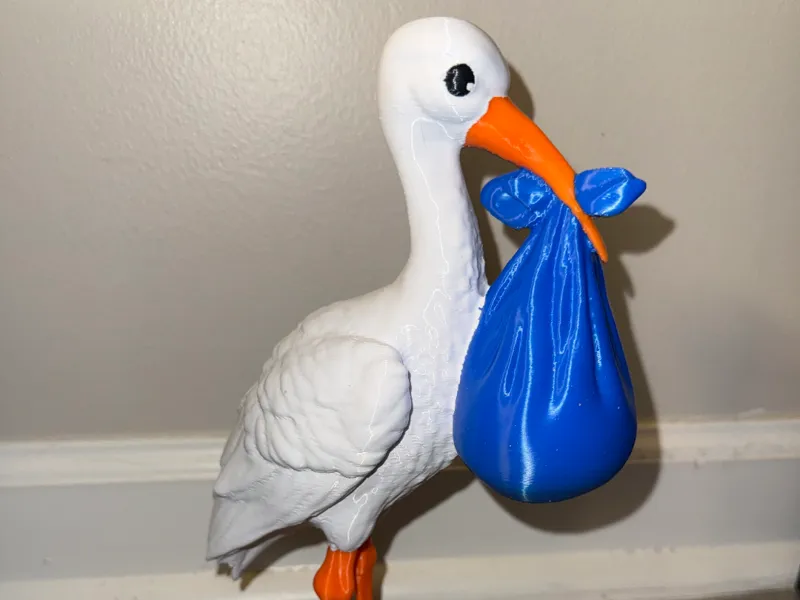 Stork Carrying Blue Baby Boy Cloth