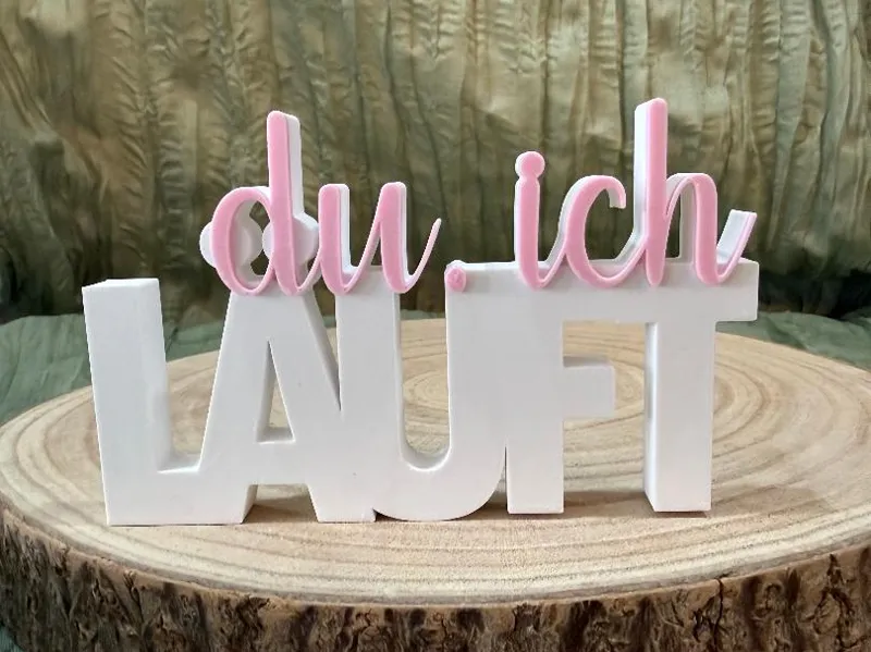Schriftzug du. ich Läuft