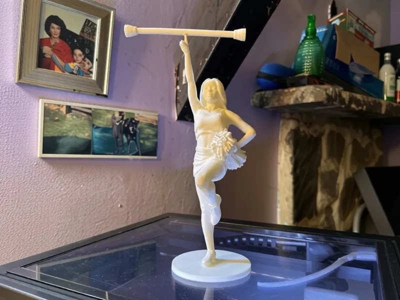 Cheerleader with spinning baton