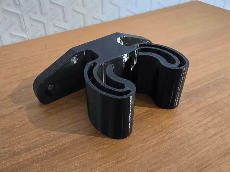 Wall holder for a broom, stick, rod or garden tool