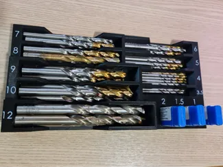 Drill bit holder for metric size bits