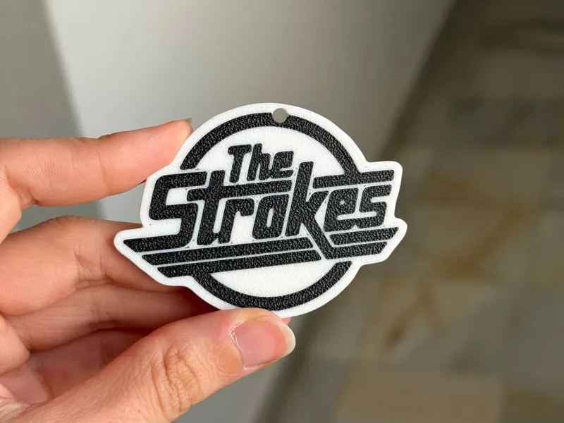 The Strokes logo band keychain