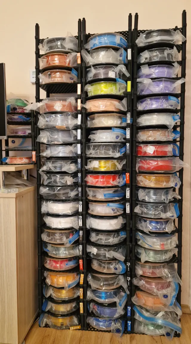 Filament spool roll storage rack with label