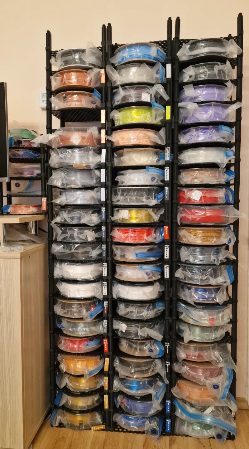 Filament spool roll storage rack with label