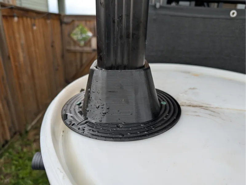Downspout base for rain barrel