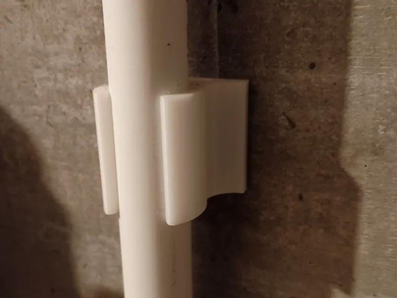 3/4" PVC clamp for cement walls w/ adhesive tape 