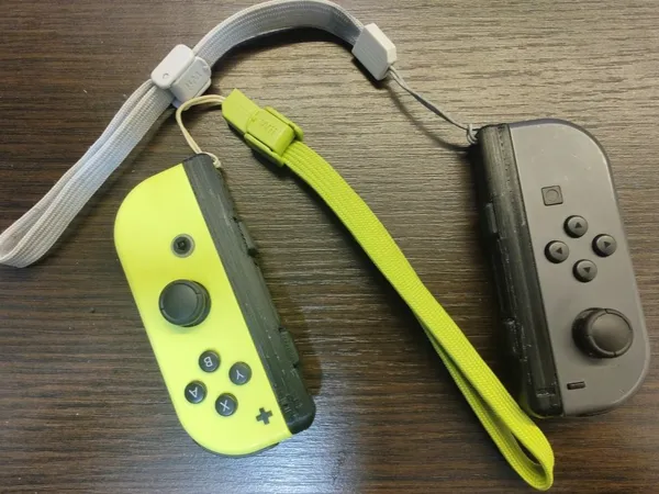 Dragonne Joy-Con avec accès LED et bouton de synchronisation