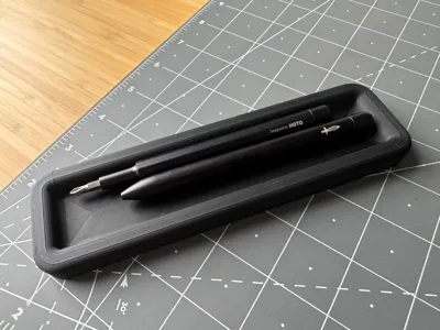Rounded pen tray