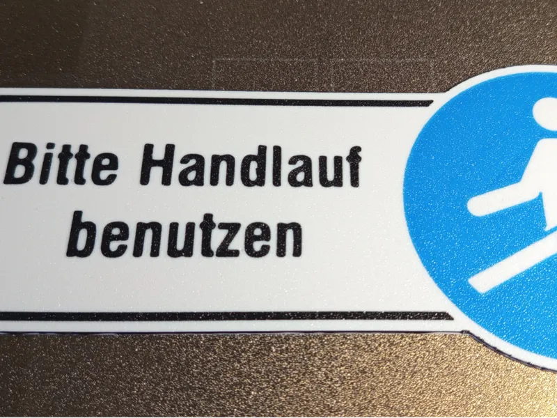 Bitte Handlauf benutzen Schild