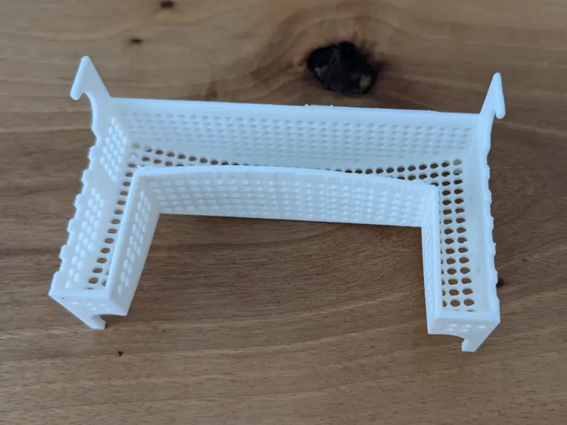 Strainer for shower floor slot drain larger holes