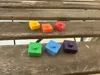 Pegged game pieces