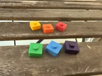 Pegged game pieces