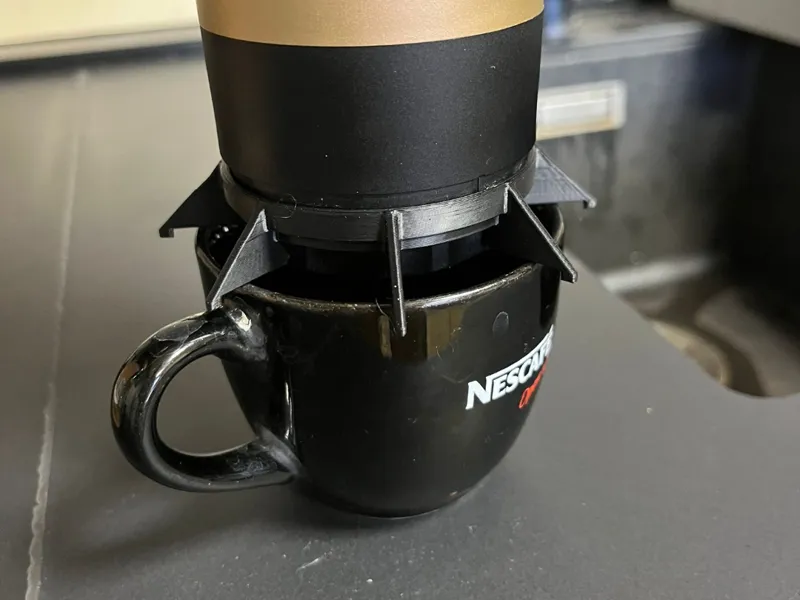 Cup stand for travel coffee maker. 