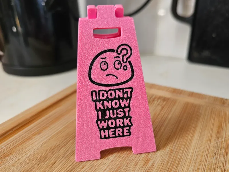 The "I Just Work Here" Desk Sign