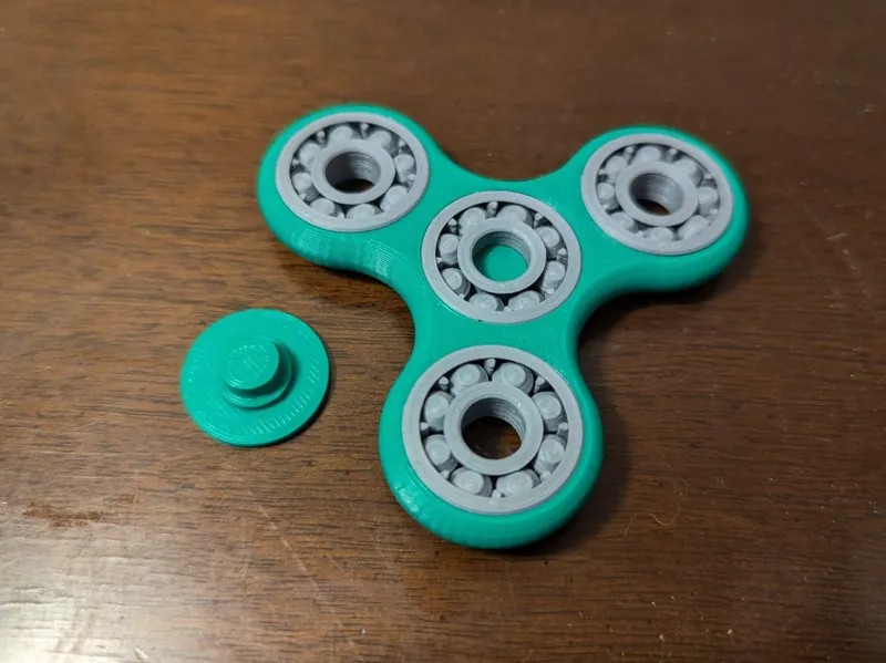 Fidget Spinner with Lower Friction Caps