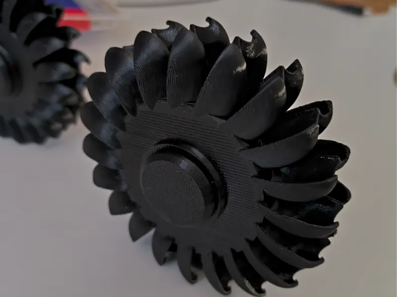 Pelton turbine spinner