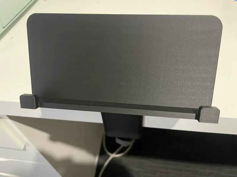 Desk mounted phone holder